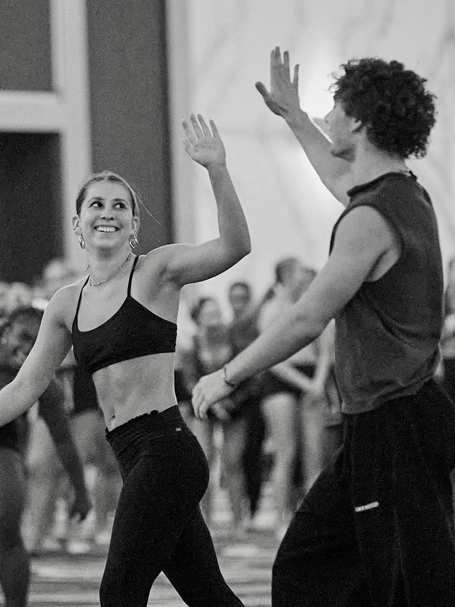 Dancers high-fiving during a Collegiate Dance Team Night class